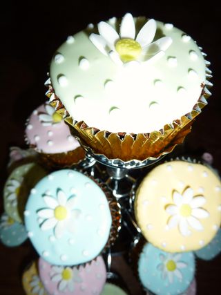 Pastel coloured wedding cup cakes with matching 2 tier wedding cake