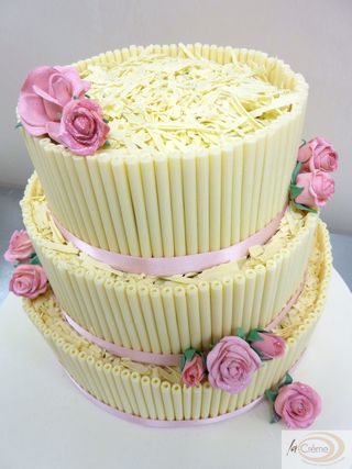 The second wedding cake was a three tier white cigarillo cake with pink