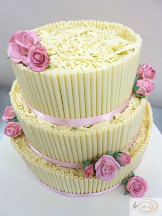 The second wedding cake was a three tier white cigarillo cake with pink 