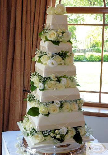 5 Tier Ivory Square Wedding Cake with fresh flowers and elegant ivory piping