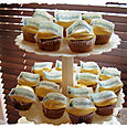 Coloplast Cup cakes displayed on a stand