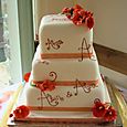 3 tier ivory wedding cake painted with names