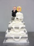 Suitcase wedding cake with bride and groom figures