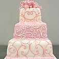 3 tier piped pink present wedding cake