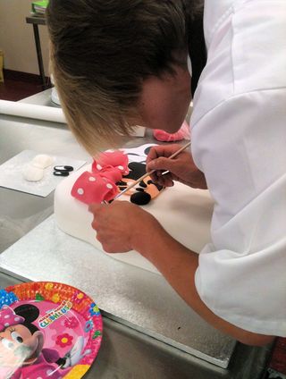 Mel making minnie mouse cake