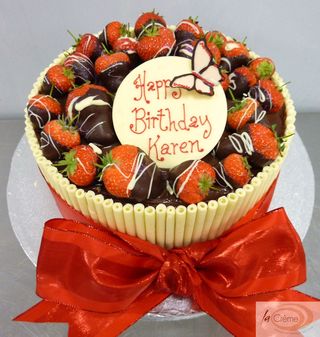 Chocolate cigarello birthday cake with dipped strawberries S