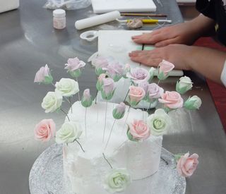 Rebecca making handmade sugar hands