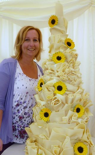 Sian with a white chocolate wrapped wedding cake