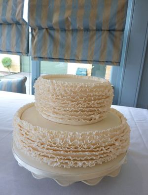 2 tier ivory ruffle wedding cake s