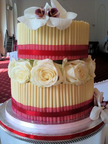 2 tier white cigarello wedding cake with roses